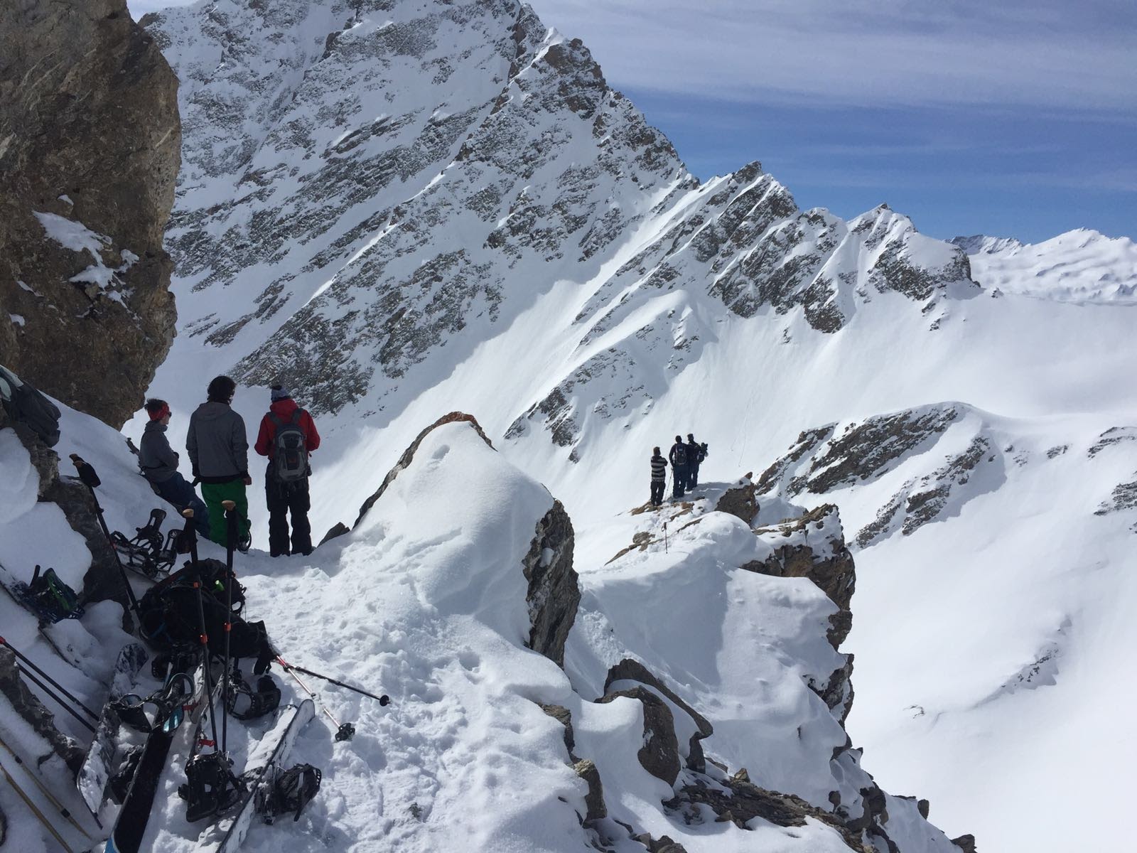 Riders on a snowy ridge above Courmayeur, Mont Blanc massif