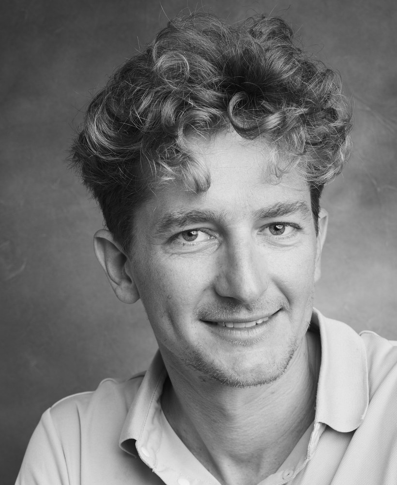 Black and white portrait of Alberto Broggi